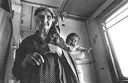 Grandmother with child in train wagon